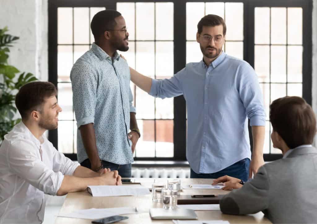 A manager introducing a new employee to their colleagues